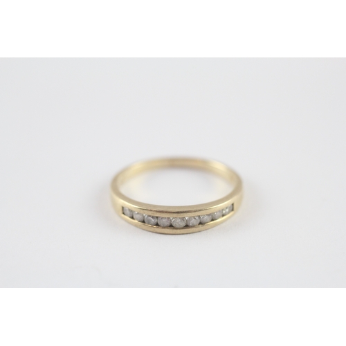 118 - 9ct gold diamond channel set half eternity ring (1.8g) Size M