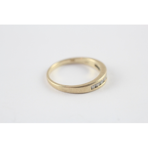 118 - 9ct gold diamond channel set half eternity ring (1.8g) Size M