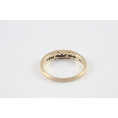 118 - 9ct gold diamond channel set half eternity ring (1.8g) Size M