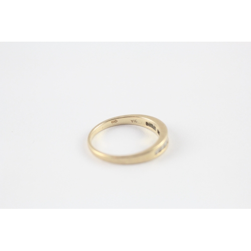 118 - 9ct gold diamond channel set half eternity ring (1.8g) Size M
