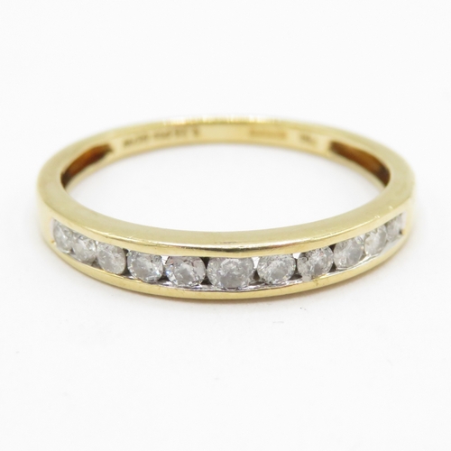 194 - 18ct gold diamond channel set half eternity ring  (1.6g) Size M