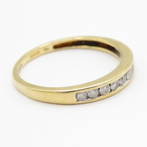 194 - 18ct gold diamond channel set half eternity ring  (1.6g) Size M