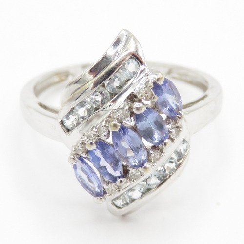 195 - 9ct gold diamond, tanzanite and gemstone dress ring (2.7g) Size P