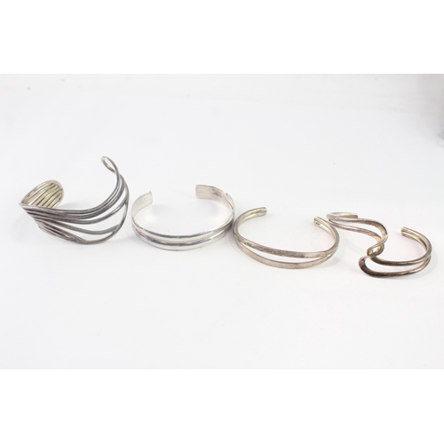 213 - Collection of Sterling Silver Bangles inc. Modernist, Twist, Wave x 4 (98g)