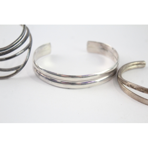 213 - Collection of Sterling Silver Bangles inc. Modernist, Twist, Wave x 4 (98g)