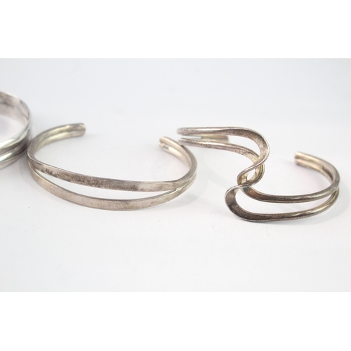 213 - Collection of Sterling Silver Bangles inc. Modernist, Twist, Wave x 4 (98g)