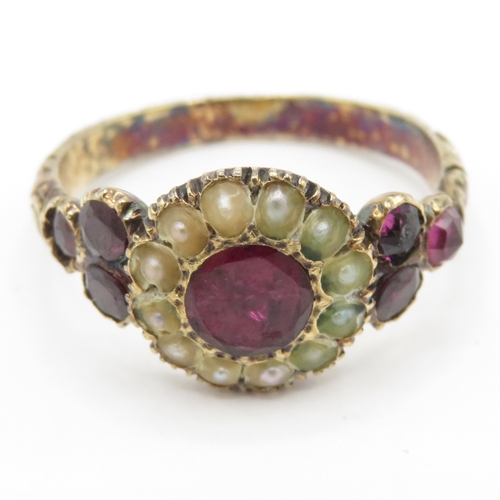 113 - 9ct gold Victorian foiled back garnet & seed pearl dress ring with a patterned band (2.8g) Size N
