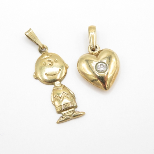 193 - 2 x 9ct gold pendants/charms including Charlie Brown (2.4g)