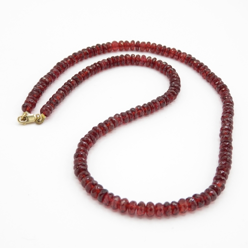 72 - 14ct gold faceted garnet necklace (24.6g)