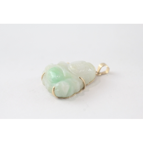 109 - 14ct gold carved Buddha jade pendant (3.6g)