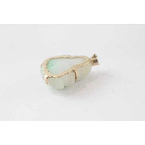 109 - 14ct gold carved Buddha jade pendant (3.6g)