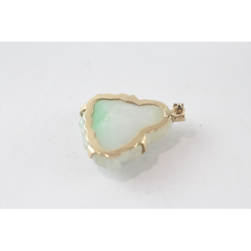 109 - 14ct gold carved Buddha jade pendant (3.6g)