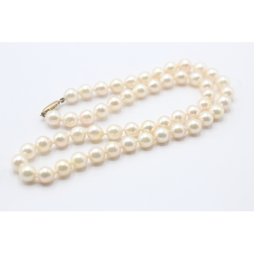 62 - 9ct gold cultured pearl necklace (29.7g)