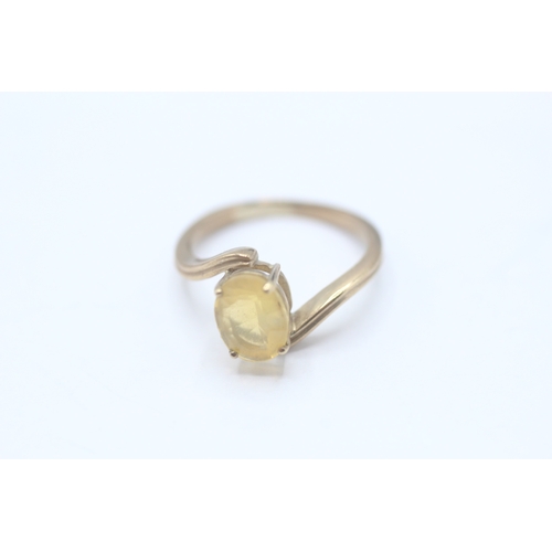 63 - 9ct gold yellow gemstone dress ring (2.2g) Size K