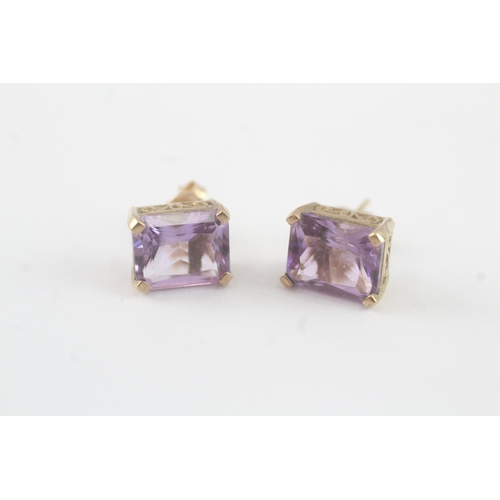 64 - 9ct gold amethyst stud earrings (2.7g)