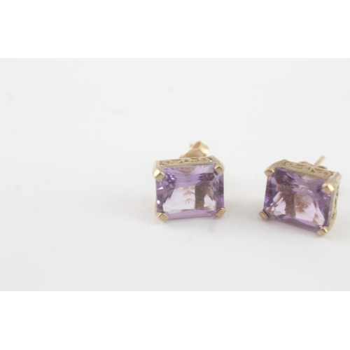 64 - 9ct gold amethyst stud earrings (2.7g)