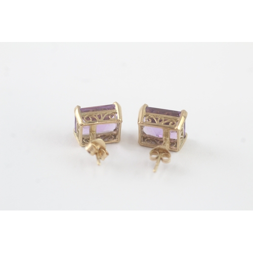 64 - 9ct gold amethyst stud earrings (2.7g)