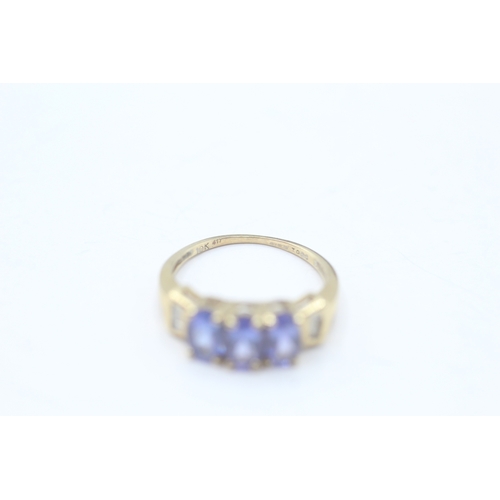 65 - 9ct gold tanzanite & diamond dress ring (2g) Size J 1/2