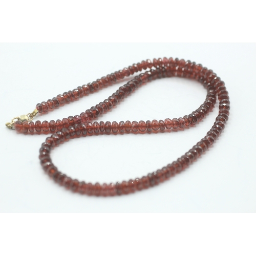 72 - 14ct gold faceted garnet necklace (24.6g)