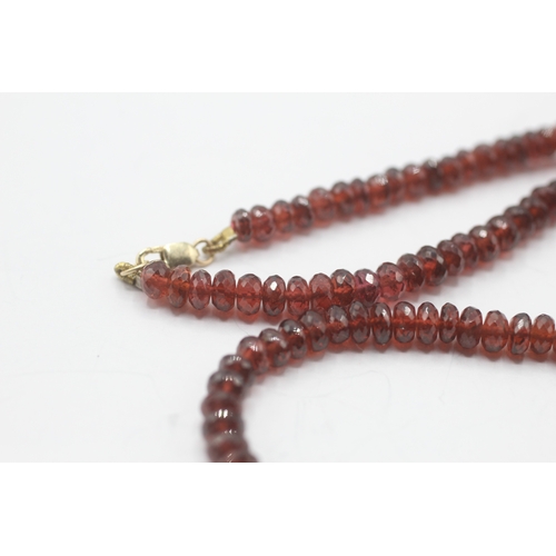 72 - 14ct gold faceted garnet necklace (24.6g)