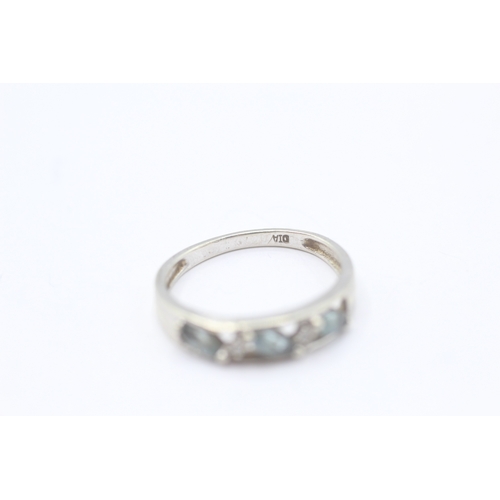 88 - 9ct gold blue topaz & diamond half eternity ring (2.4g) - misshapen Size N