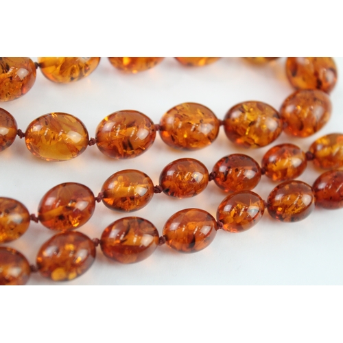 98 - 9ct gold amber necklace (51.9g)