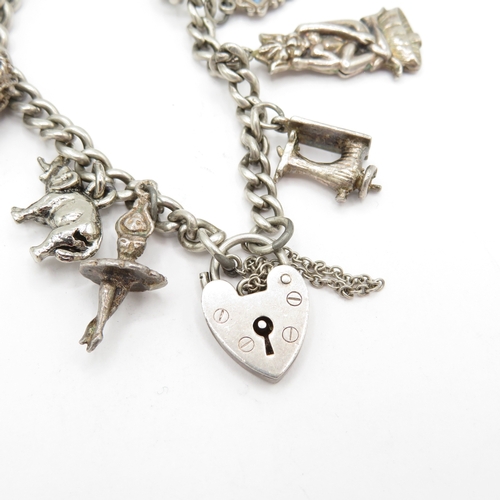 222 - 2 x Mixed Grade Silver Charm Bracelets inc Skis, Scissors and St Christopher's - 63.5g