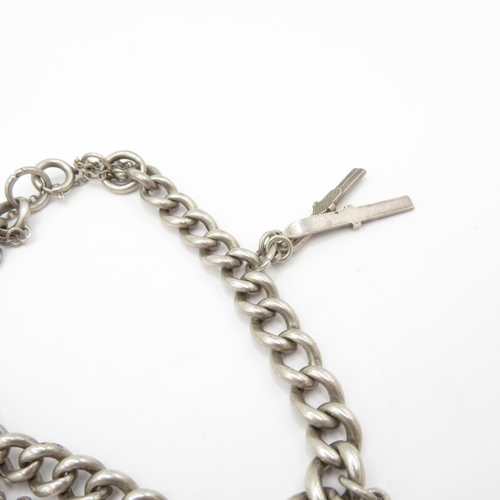 222 - 2 x Mixed Grade Silver Charm Bracelets inc Skis, Scissors and St Christopher's - 63.5g