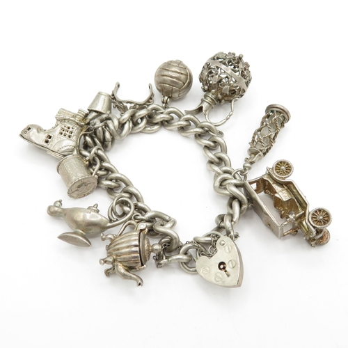 224 - Sterling Silver Charm Bracelet inc Genie Lamp and Football - 74.9g