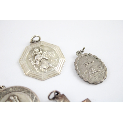 230 - Collection of Sterling Silver Georg Jensen Pendants, inc. St Christopher, Cross, Transport x 8 (61g)