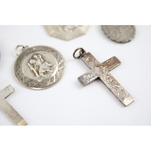 230 - Collection of Sterling Silver Georg Jensen Pendants, inc. St Christopher, Cross, Transport x 8 (61g)