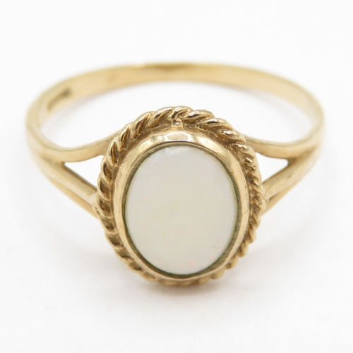 198 - 9ct gold hallmarked Birmingham opal solitaire ring  (1.4g) Size M