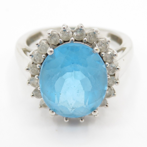 63 - 9ct gold blue topaz & diamond dress ring (4.6g) Size M