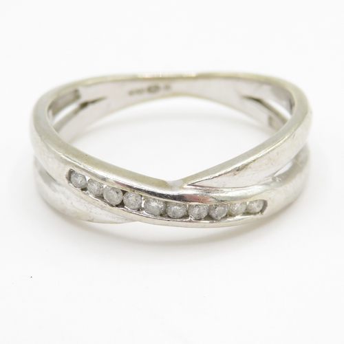 71 - 9ct gold diamond cross-over ring (2.8g) Size O