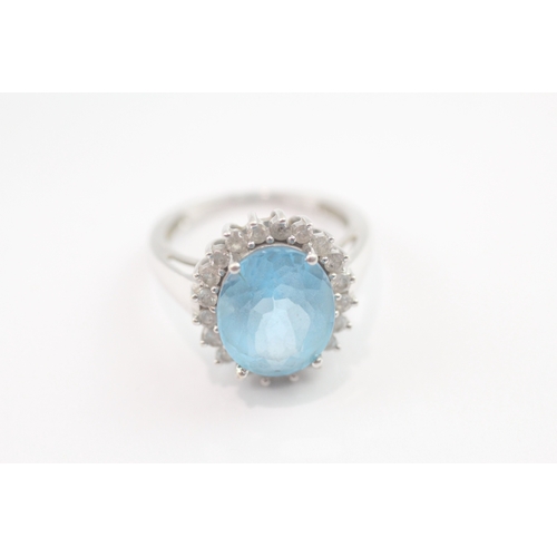 63 - 9ct gold blue topaz & diamond dress ring (4.6g) Size M