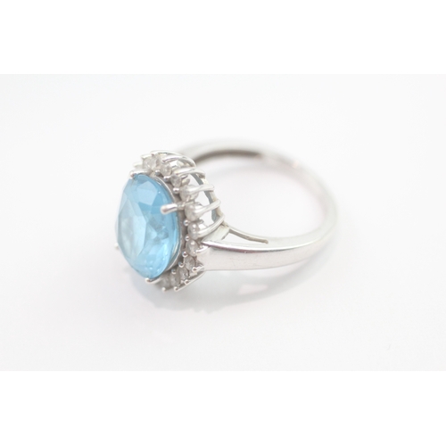 63 - 9ct gold blue topaz & diamond dress ring (4.6g) Size M