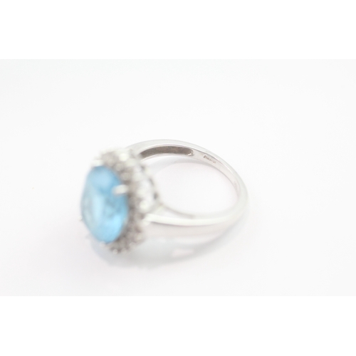 63 - 9ct gold blue topaz & diamond dress ring (4.6g) Size M