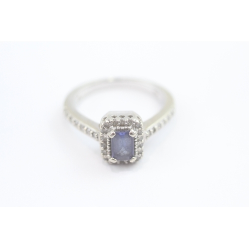 69 - 14ct white gold diamond and tanzanite dress ring (5.2g) Size N