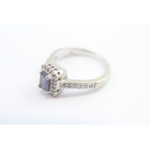 69 - 14ct white gold diamond and tanzanite dress ring (5.2g) Size N