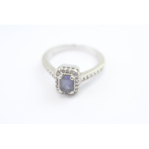 69 - 14ct white gold diamond and tanzanite dress ring (5.2g) Size N