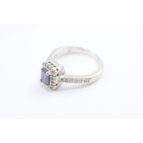 69 - 14ct white gold diamond and tanzanite dress ring (5.2g) Size N