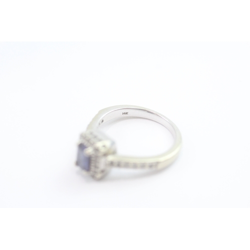 69 - 14ct white gold diamond and tanzanite dress ring (5.2g) Size N