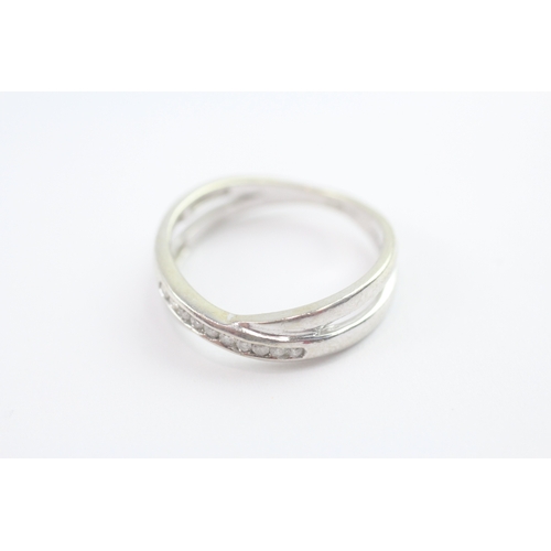 71 - 9ct gold diamond cross-over ring (2.8g) Size O