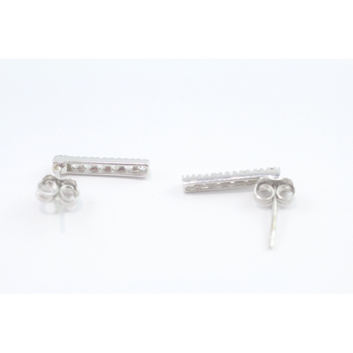 77 - 9ct white gold diamond stud earrings (1.3g)
