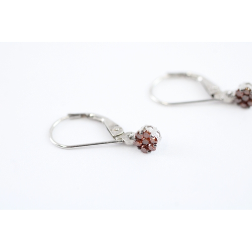 92 - 9ct gold enhanced red diamond drop earrings (1g)