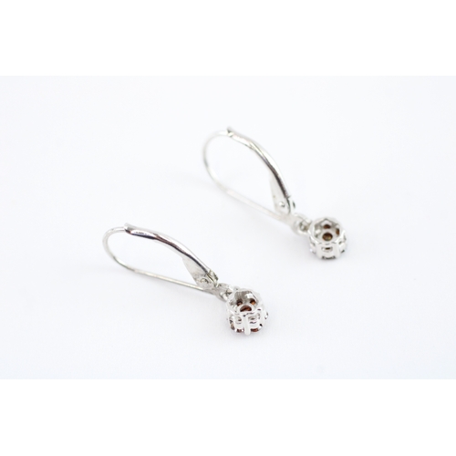 92 - 9ct gold enhanced red diamond drop earrings (1g)