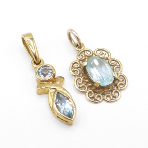 31 - 2 x 9ct Gold Topaz Pendants (1.9g)