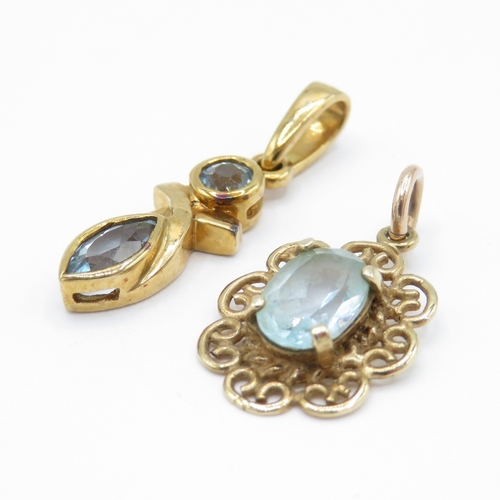 31 - 2 x 9ct Gold Topaz Pendants (1.9g)