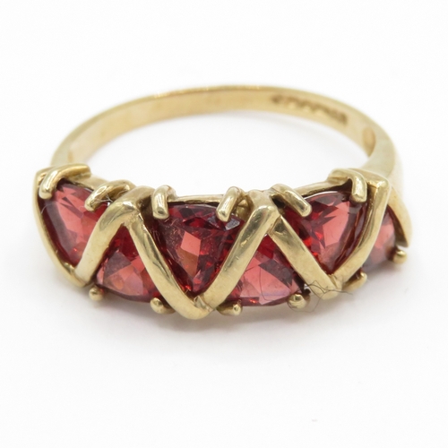 29 - 9ct gold garnet five stone dress ring (3.2g) Size R 1/2