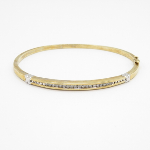 36 - 9ct gold diamond bangle (10.1g)